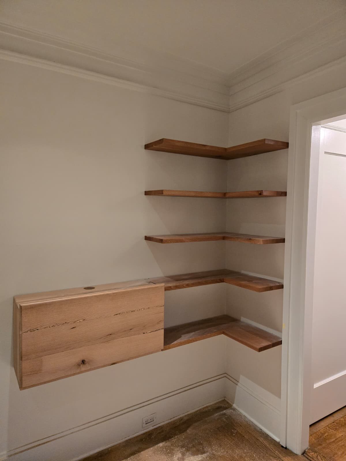 Custom floating corner shelving and wall cabinet